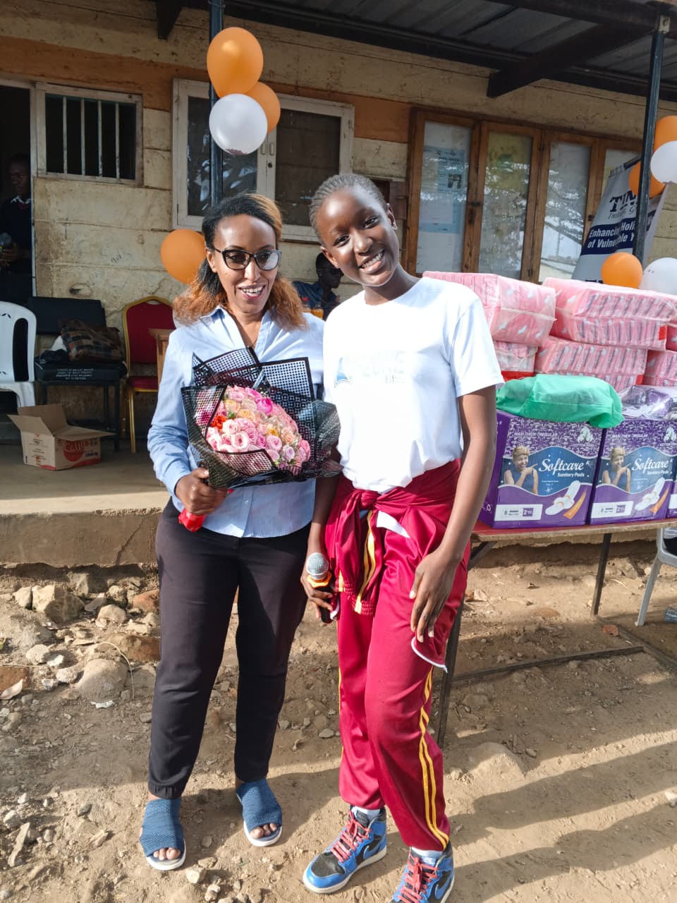Girls and young women participating in a menstrual health outreach activity